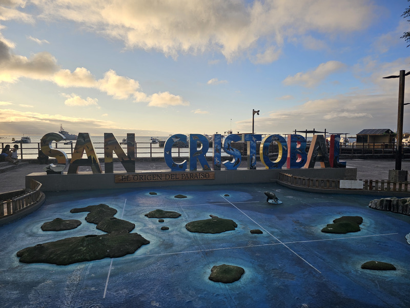 The San Cristobal Island tourist sign late in the afternoon