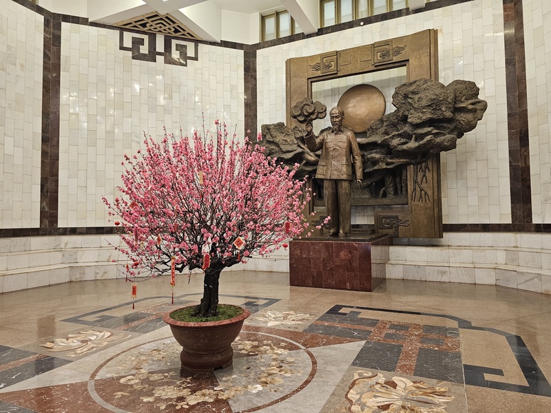 Ho Chi Minh Museum lobby with a blossoming tree for Tet