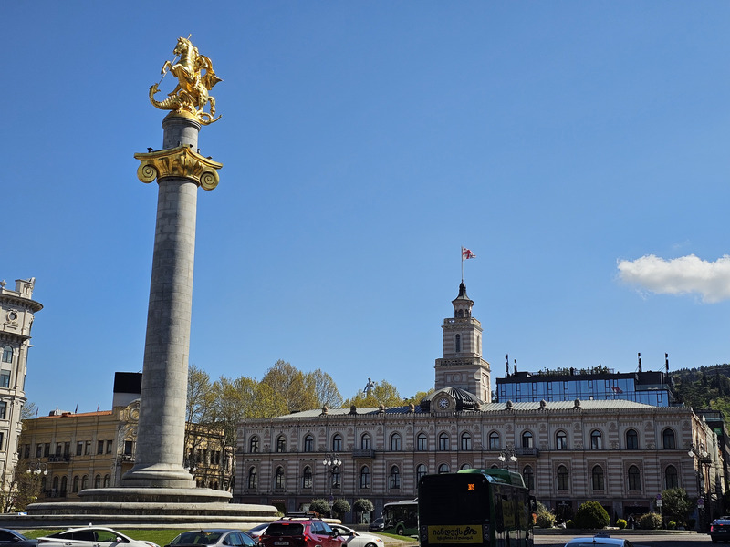 St. George monument on Freedom Square in Tbilisi under a clear blue sky.