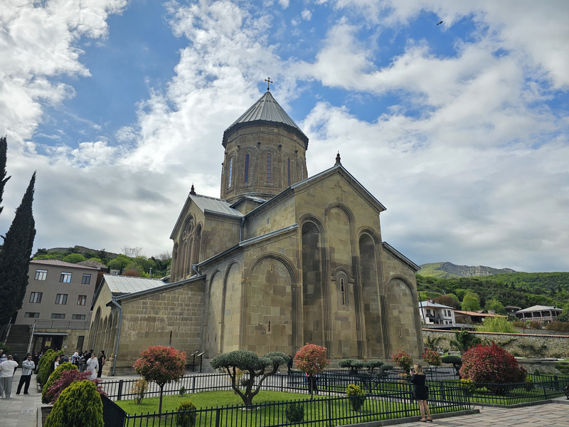 Samtavro's Convent church in Tbilisi, Georgia, under a cloudy sky.