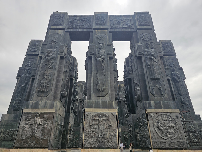 Relief-covered pillars of the Chronicle of Georgia monument in Tbilisi.