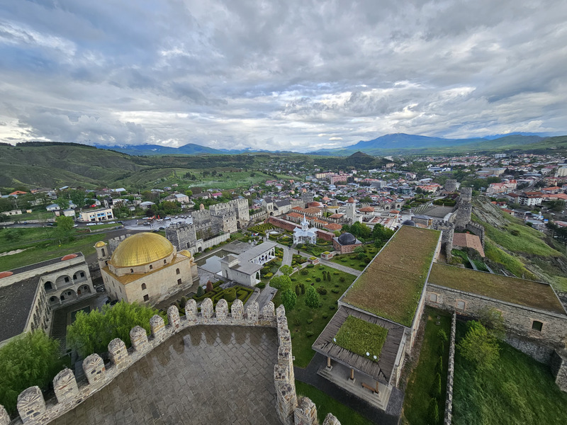 Panorama of Rabati Castle and Akhaltsikhe beneath dramatic clouds in Georgia.